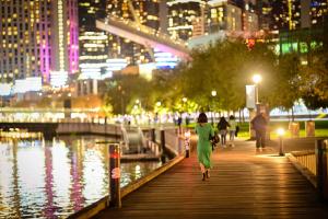 woman walking on MCEC lawn boardwalk